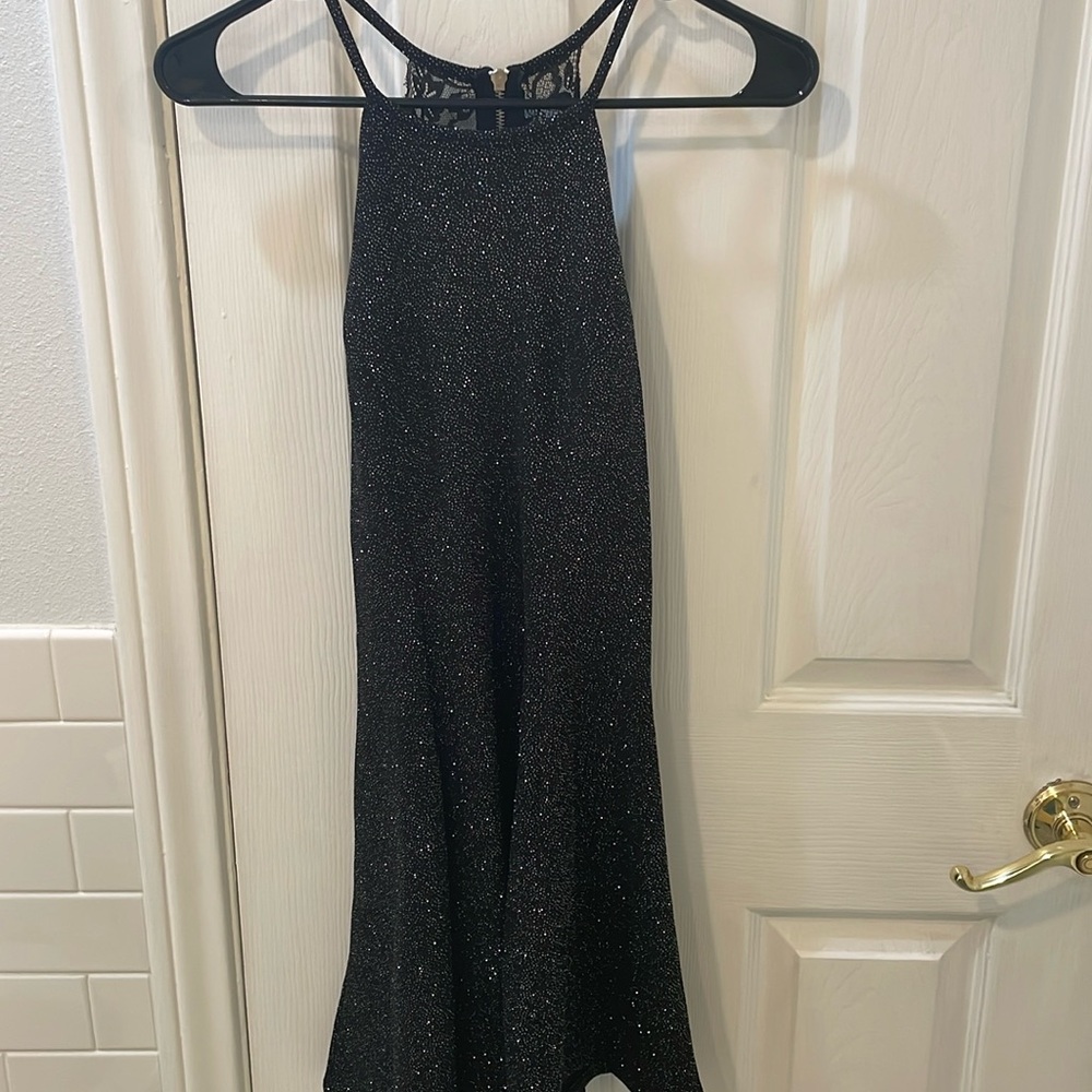 Short, black, sexy, glittery cocktail dress. Perfect for dates and parties.
